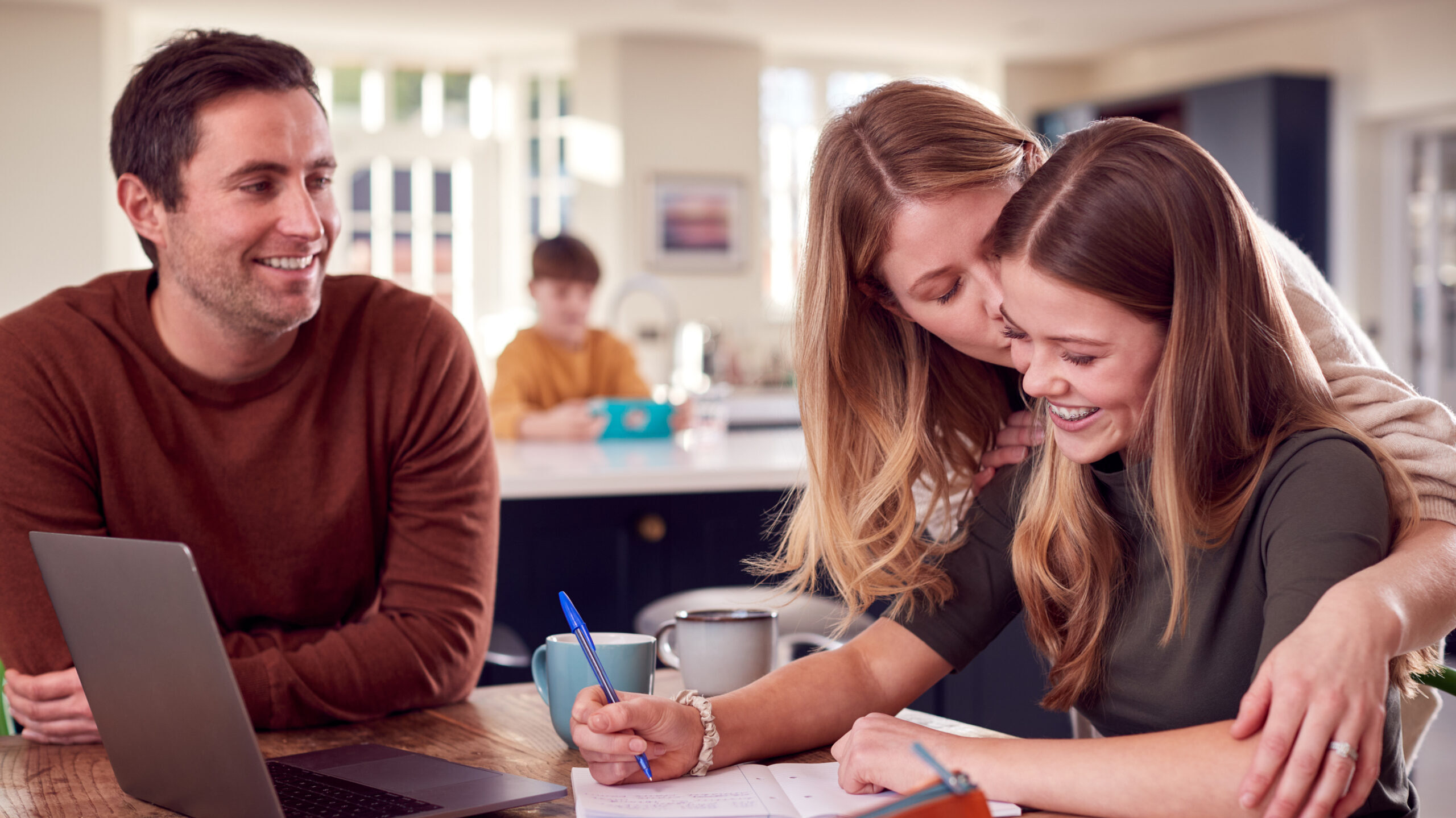 Parents and teen planning back to school shopping budget.